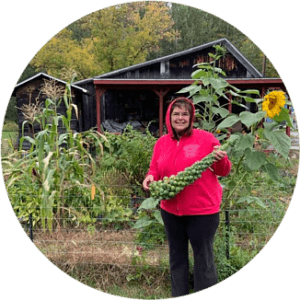 Chris holding Brussels Sprouts from my garden 2020